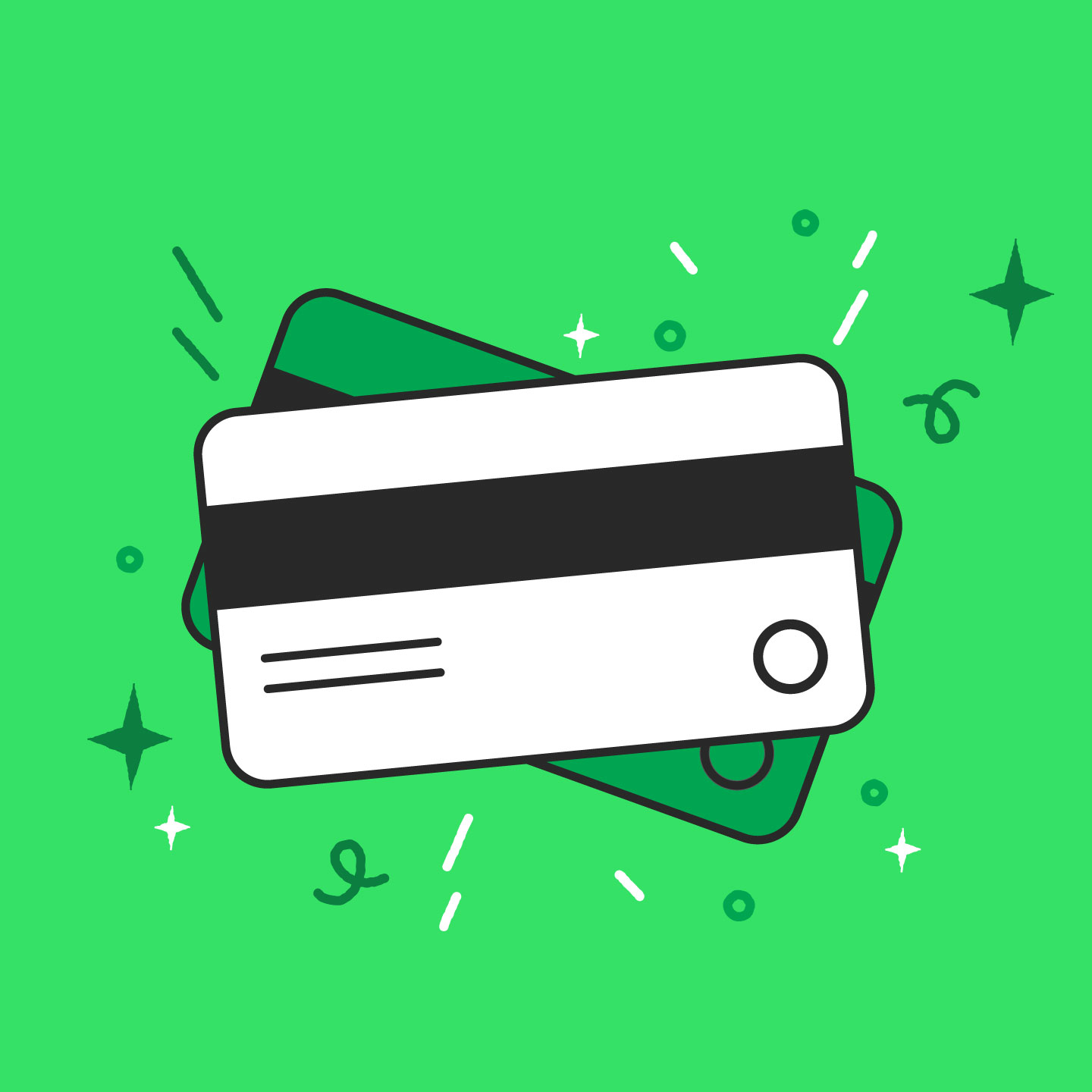 Man looking at his phone and credit card sitting at table